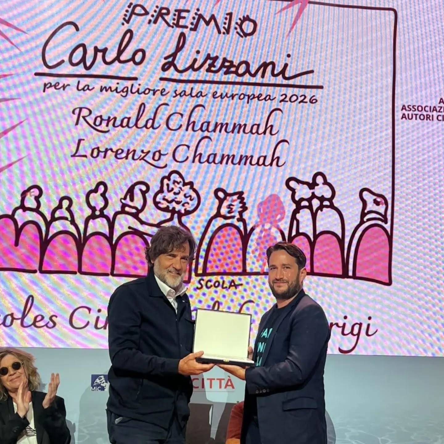 Ronald y Lorenzo Chammah recibiendo el premio Carlo Lizzani